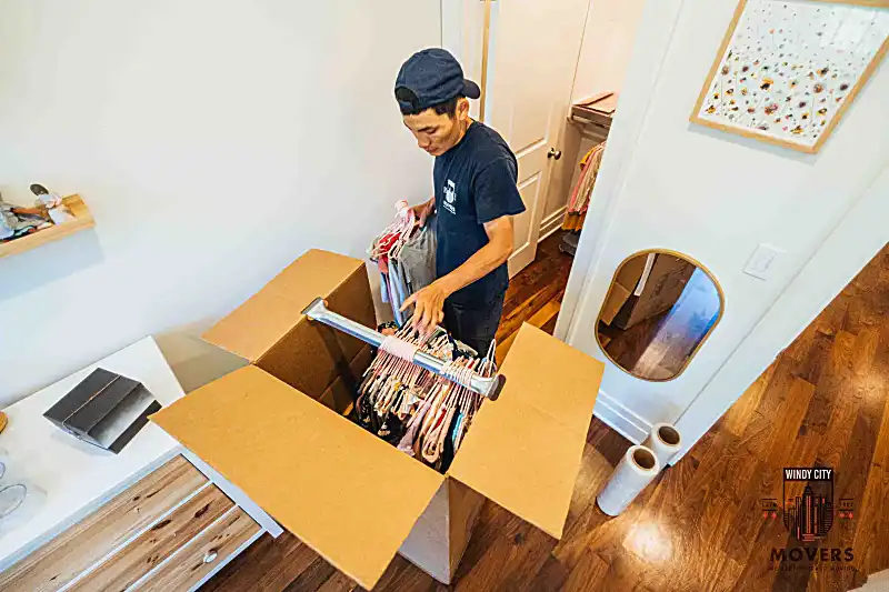 Crew handling furniture inside a home
