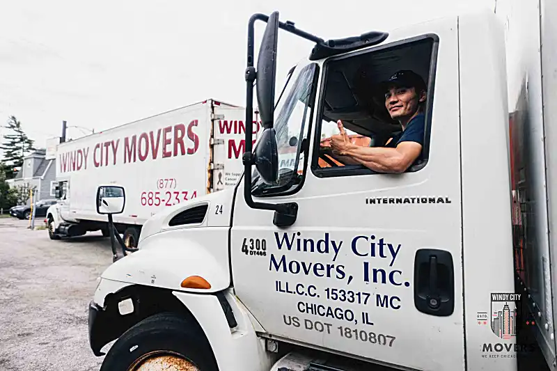 Movers carefully transporting items through a doorway