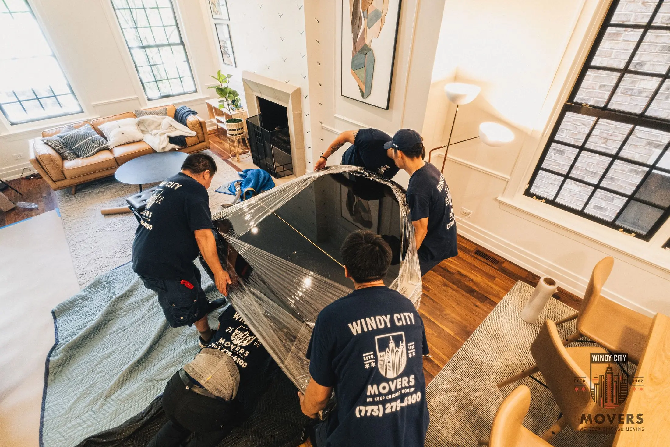 Windy City Movers crew moving a piano in Chicago