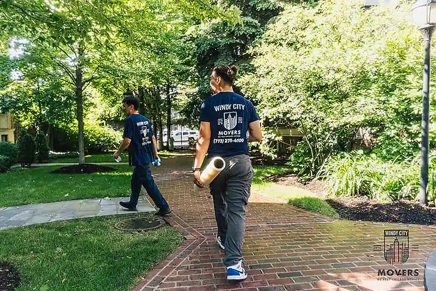 Windy City Movers team member carrying boxes